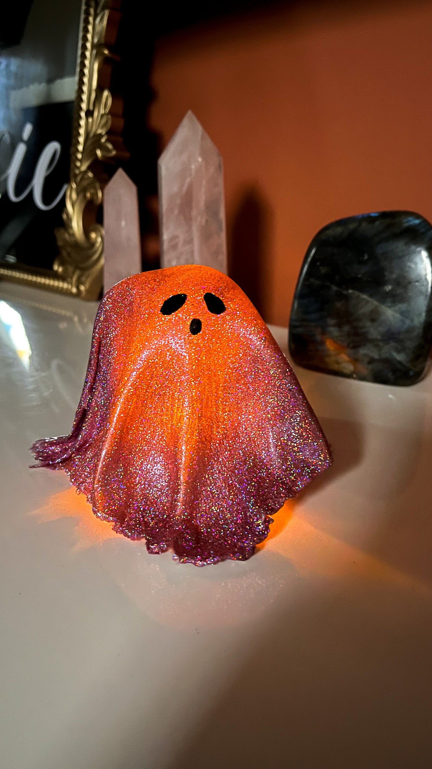 Pink Holographic Ghost